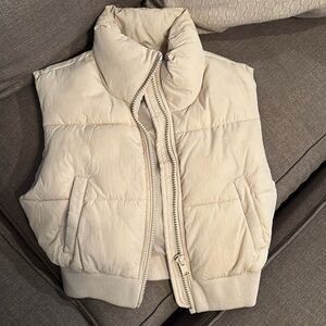 Beige puffer vest. Used